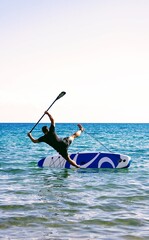 Surfer falling off the board