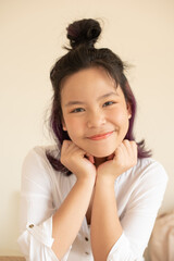 Naklejka premium Happy teen girl 11-15 year old. Portrait beautiful woman smiling with perfect smile and white teeth. asian lady girl wear casual cloth with smiling looking at camera. White background.