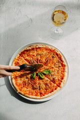 Traditional Italian pizza, vegetables, ingredients on a light background.Pizza menu. View from above. Place for text.