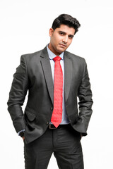 Young indian businessman in classic suit giving expression.