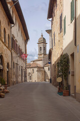 narrow street in the village of  San Quirico d'Orcia in Italy