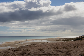 Fototapeta na wymiar Calm Atlantic ocean and a cloudy sky, Fuertventura