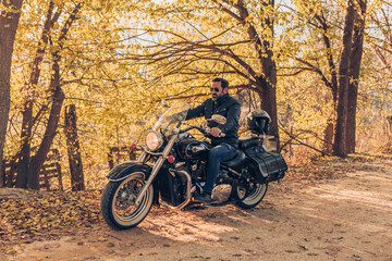 Obraz na płótnie Canvas Motorcyclist through the countryside