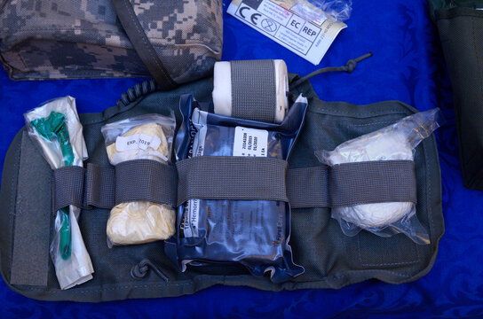 Backpack with soldier s first aid kit: bandages, wound-healing drugs, balloon with burn-treating gel, painkillers