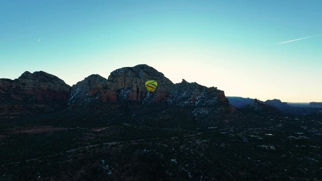 Flying Hot Air Balloon In Sedona, Arizona At Dawn. Aerial Wide Shot