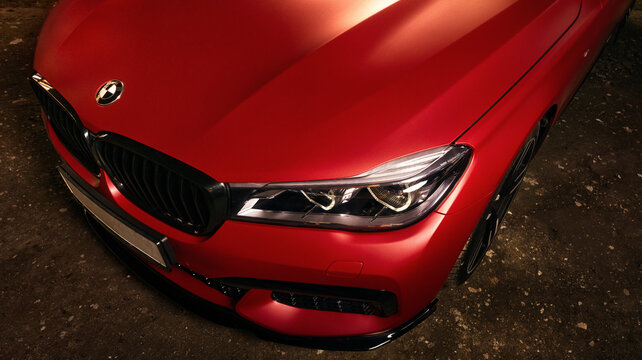 Los Angeles, California; April 02, 2023 red BMW 7 car with M Performance package matte. Close-up of the hood