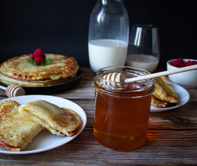 Delicious pancakes with berries and honey. Sweet food. Morning
