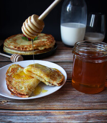 Delicious pancakes with berries and honey. Sweet food. Morning