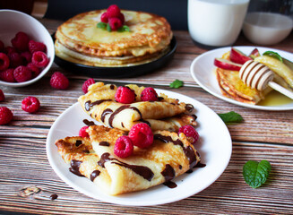 Delicious pancakes with berries and honey. Sweet food. Morning
