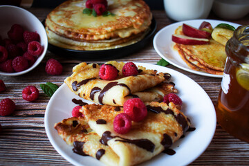 Delicious pancakes with berries and honey. Sweet food. Morning