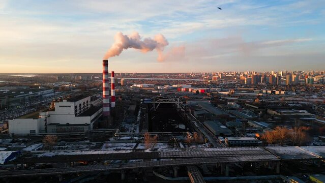 Factory industrial site aerial view. Smokestacks producing smoke, concept of pollution, industrialization, climate change
