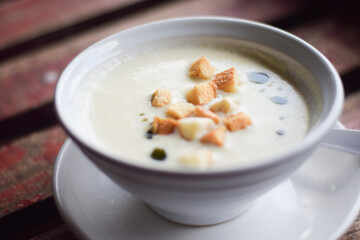 mushroom soup in bowl on wooden table