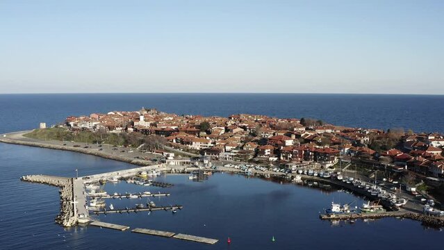 Aerial reveal of Nesebar Black Sea fishing harbour holiday town Bulgaria