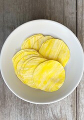 Dumpling dough on wood background