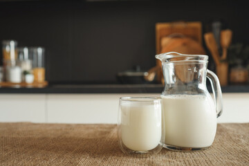 Fresh natural milk in a glass and jug at home