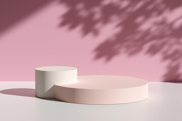 Two glossy pastel pink and cream colored round podiums against pink wall with tree leaf shadows and natural sunlight.
