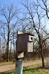 A close view of the wood birdhouse.