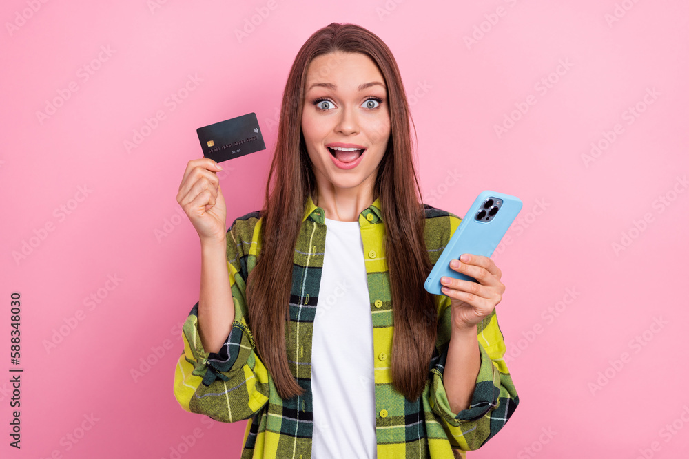 Sticker portrait of ecstatic impressed girl with straight hairdo wear plaid shirt hold smartphone debit card