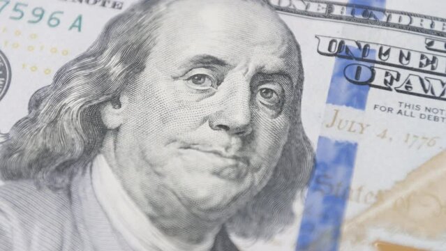 US currency featuring Benjamin Franklin, symbolizing the success and wealth achieved through business investments and smart financial management.