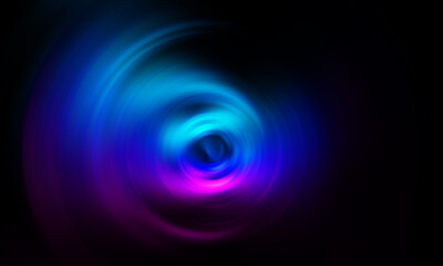 Blue and pink abstract color swirl with blurry abstract style isolated over black background