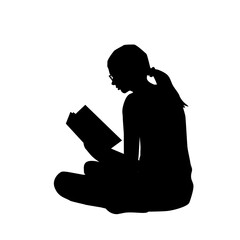 Silhouette  of a young woman reading a book - 588359031