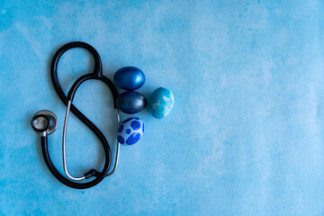 Blue eggs and a stethoscope, Easter and medical concept Selective focus