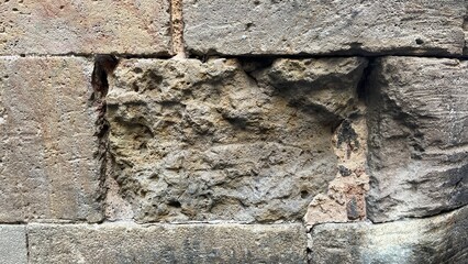 Textured stone sandstone surface. Close up image bricks
