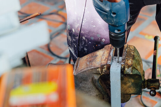Image of Metalworker working on a drilling machine