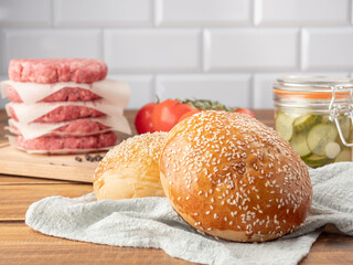Ingredients for a hamburger on a light background.