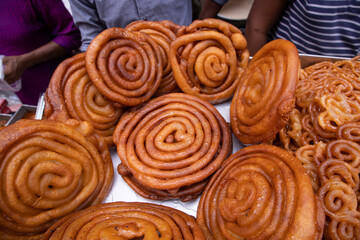 Delicious Testy sweet fried jalebi showing for sale on a street food market in the Chakbazar, Dhaka-Bangladesh
