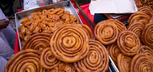 Delicious Testy sweet fried jalebi showing for sale on a street food market in the Chakbazar, Dhaka-Bangladesh