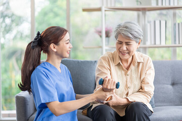 Asian women are being cared for by nurses who monitor health and physical therapy for elderly women living alone at home. by walking on a cane or using muscles