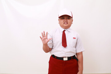 Elementary school student wearing red white uniform and showing five fingers. Isolated on white