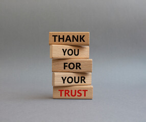 Thank you for your trust symbol. Wooden blocks with words Thank you for your trust. Beautiful grey...