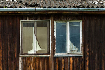 Old worn ruined wooden prefabricated house