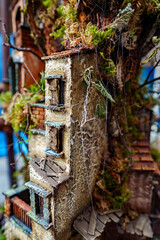 Italian handmade figurines of paper-mache houses.