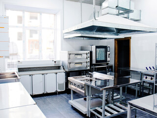 interior kitchen in a cafe or restaurant, professional kitchen equipment and appliances in the...