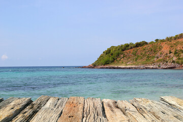 Wooden pier on the beach with turquoise sea and blue sky, Wooden table, Wooden floor, Sea of Thailand.