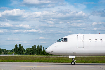 Aircraft nose side view, airplane on runway