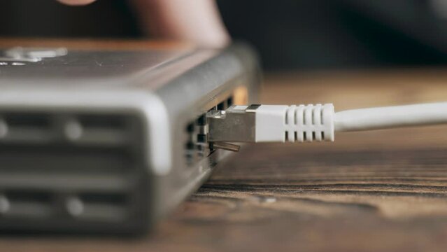 Disconnecting the network cable to the network equipment in the room. Network hardware.