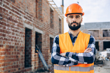 Foreman working ob building object wearing helmet