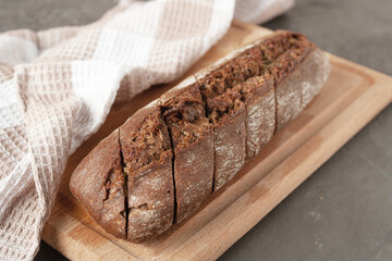 rye bread with garlic on a wooden board, copy space