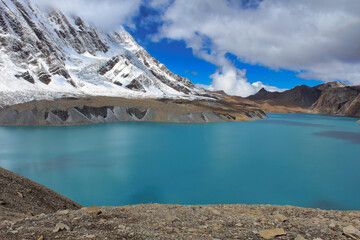 The deep luminescent blue of one of the highest lakes in the world - Tilicho Lake at 4910 meters above sea level, just below Tilicho peak, on the Annapurna circuit trek
