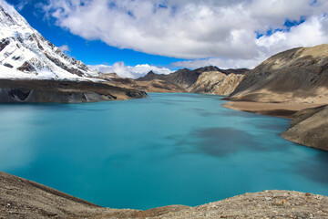 The deep luminescent blue of one of the highest lakes in the world - Tilicho Lake at 4910 meters above sea level, just below Tilicho peak, on the Annapurna circuit trek  in central Nepal