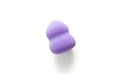 Purple makeup sponge on a white background. Means for applying professional make-up