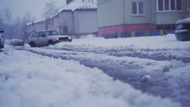 The car is skidding on the road in the snow.