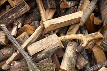 Lots of chopped oak firewood. Natural background.