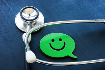 Positive patient experience concept. Stethoscope and smiley.