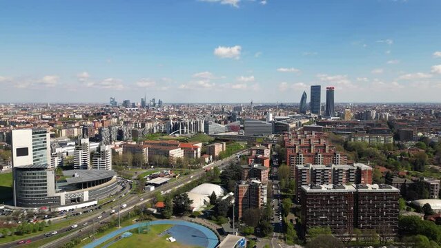 Italy , Milan 2023 - drone aerial view from Montagnetta di San Siro of downtown  with Citylife district , Garibaldi  square and Portello new modern area of the city - tourist attraction sightseeing