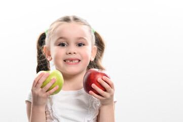 Fototapeta na wymiar On a white background, the girl holds two green and red apples in her hands